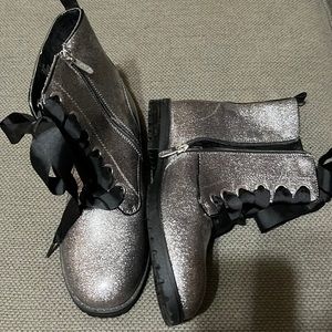 Never used Girls Boots.  Side zipper. Ribbon laces. Silver glitter.